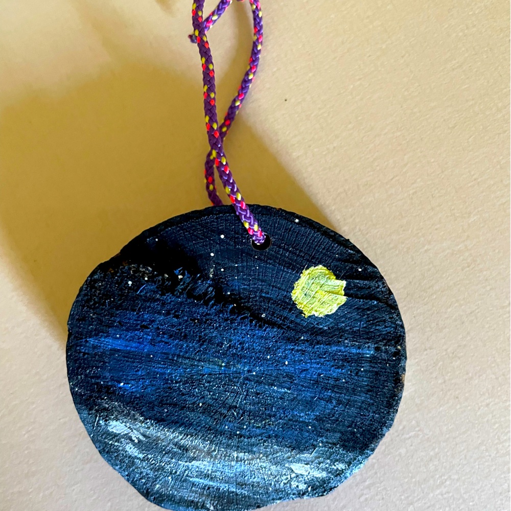 Hand painted wooden ornaments. Evening sky over the water. Approximately 3x2.5”